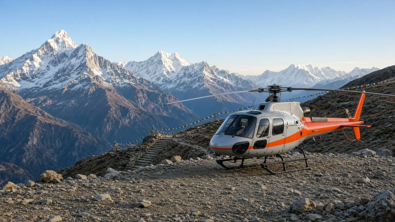 A helicopter parked on a high gravel shoulder in the Nepal Himalaya.